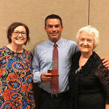 Kenneth Ludolph with Kacie Mach (Tinker Federal Credit Union) and Rebecca Barker (OK Department of Libraries). Photo taken at OLC's 2018 Adult Learner Awards.